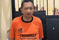 Pelaku saat dibekuk polisi.